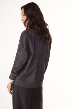 Sudadera tachas